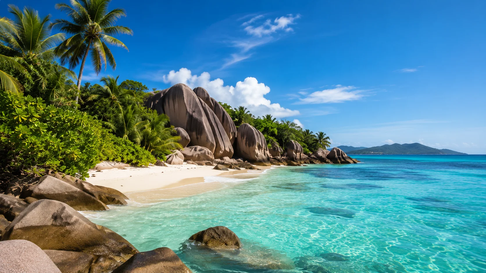 Seychelles beach with granite rocks and clear water